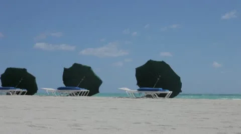 Beach Umbrellas Rattled by Summer Wind in Miami Beach Stock Footage 22253942