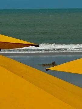 Beach umbrellas by the sea Stock Photos