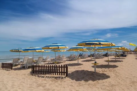 Beach with umbrellas in summer Stock Photos