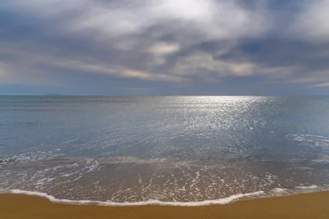 Beach under cloudy sky Stock Photos