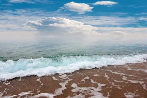 The beach under a sky Stock Photos