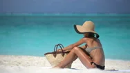 Beach Vacation Woman Applying Sunscreen Lotion On Leg At Beach - Spray Bottle Stock Footage