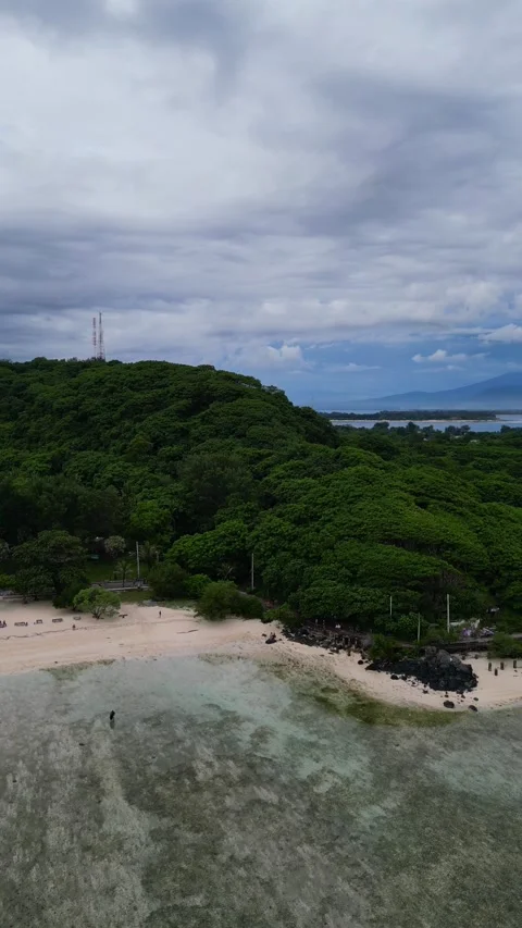 Beach vertical shot flying out Stock Footage 240097313