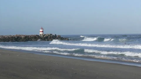 Beach view and inlet jetty lighthouse in Tavira Island Stock Footage 51135138