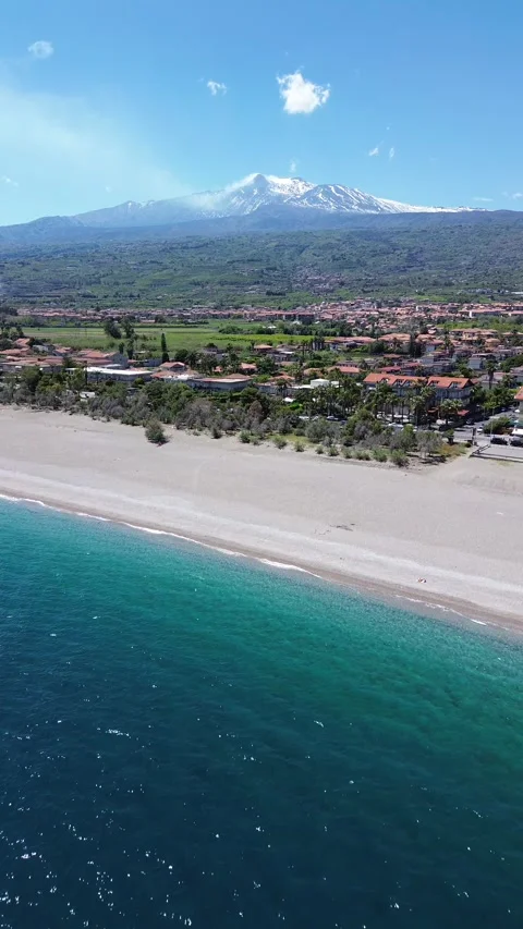Beach view with Etna volcano in the background, Sicily, Italy Stock Footage 317761544