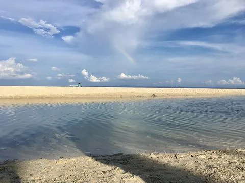Beach view with rainbow Stock Photos