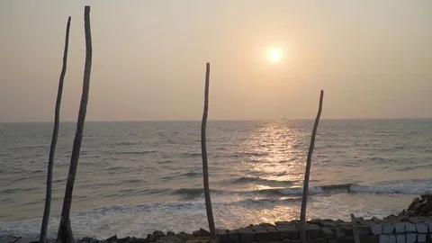 Beach view in slow motion during sunset with small waves in india kerala Stock Footage 107878121
