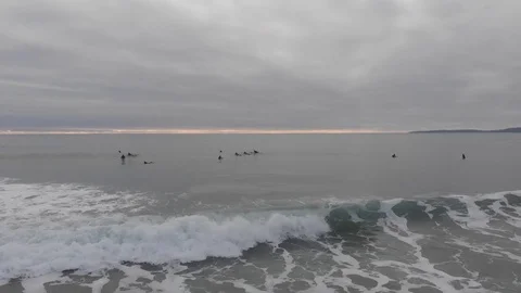 Beach view of surfers and waves Video stock 106423869