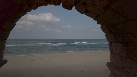 Beach view through a Roman aqueduct Stock Footage 116753725