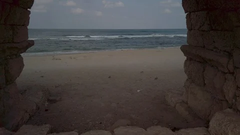 Beach view through a Roman aqueduct Stock Footage 116754113