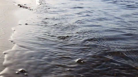 Beach view, waves break on tropical yellow sand beach. Sea waves on yellow sand Stock Footage 127358168