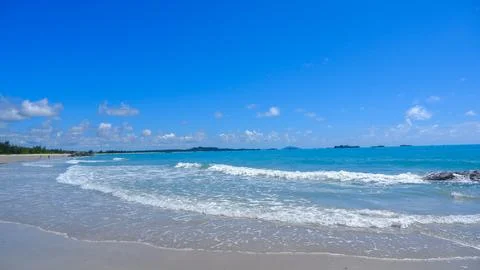 Beach View With White Waves And Blue Water Stock Photos