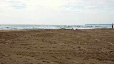 Beach, with a visible horizon line, and sand with visible tyre tracks, Stock Footage 101347119