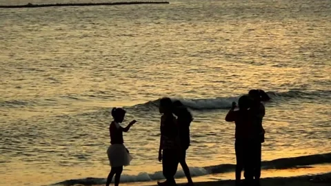 Beach visitors take selfies together Stock Footage 151943232