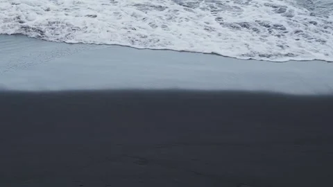 Beach with volcanic black sand Stock Footage 254485620