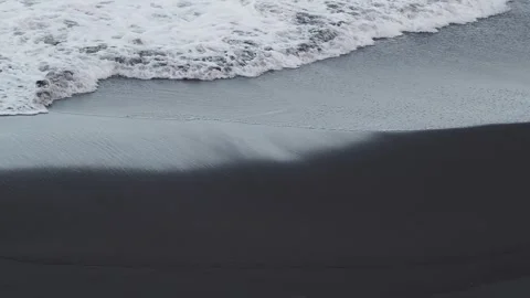 Beach with volcanic black sand Stock Footage 254485641
