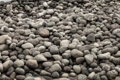 Beach of volcanic rocks Stock Photos