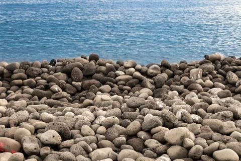 Beach of volcanic rocks Stock Photos