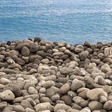 Beach of volcanic rocks Stock Photos