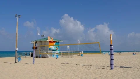 Beach volleyball, Empty beach, Blue sky with a clouds, lifeguard tower Stock Footage 251538690