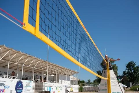 Beach volleyball net with referee during tournament Stock Photos