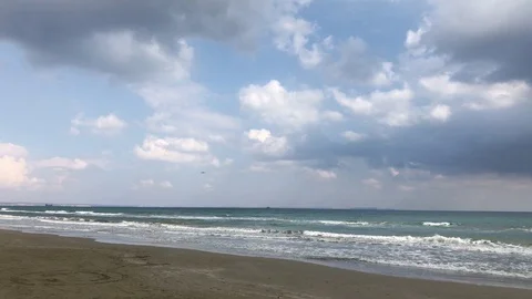 Beach vs Sea against Cloudy Sky Stock Footage 98179975