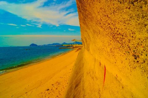 Beach wall and sandy beach Stock Photos