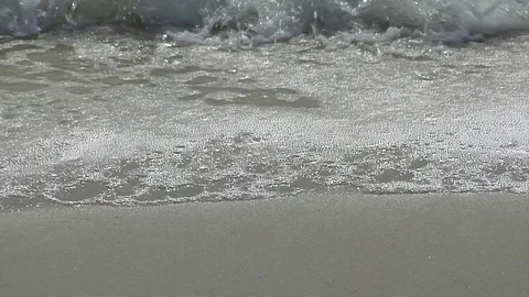 Beach wash, ECU full screen approaching and receding out of frame Stock Footage 70051134