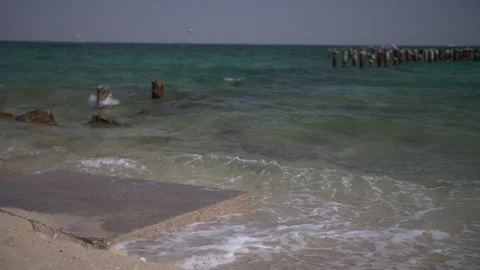 Beach - Wave Crash - Side Angle -Small Dock Stock-Footage 139533961