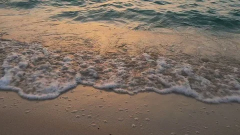 Beach wave during sunset Stock Footage 101347456
