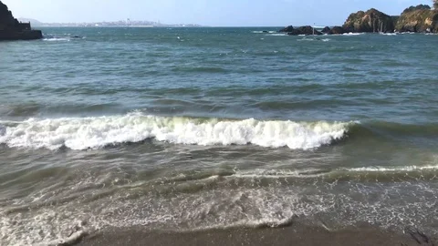 Beach wave gently breaking on the shore, beautiful city landscape in Europe 動画素材 126105843