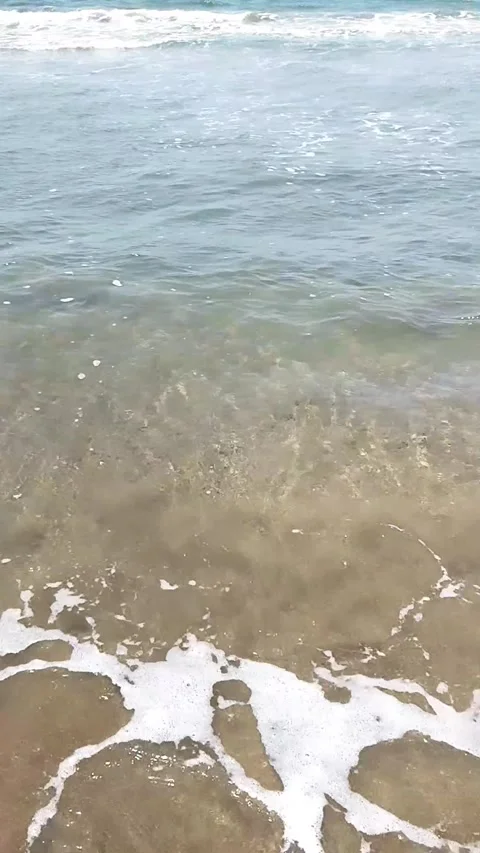 Beach Wave splashing over on sand Видео 342698104