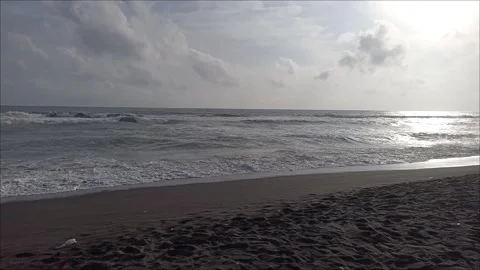 Beach waves in the afternoon with black sand Stock Footage 302072842