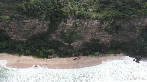 Beach waves and cliffs from aerial video Stock Footage 217903604