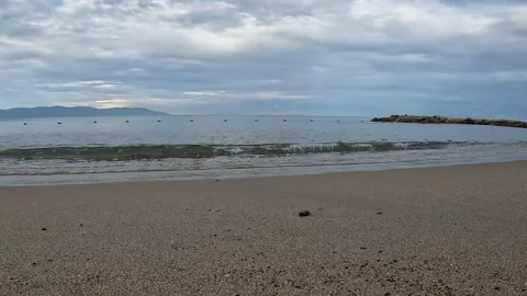 Beach with waves and mountains Stock Footage 214437477