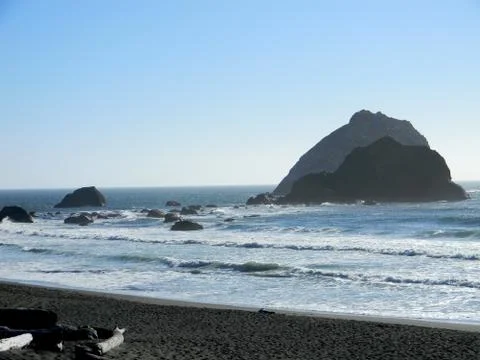 Beach waves and rocks Stock Photos