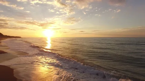 BEACH WAVES AND SUNSET Stock Footage 130865711