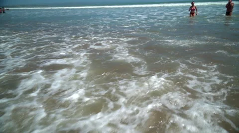 Beach Waves and Walking Couple Stock Footage 50384690