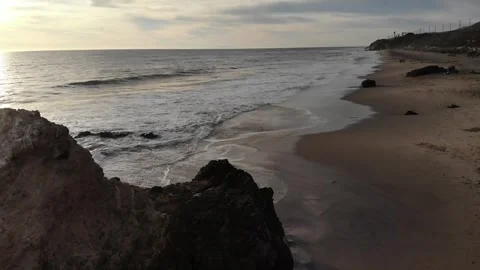 Beach waves with Caves - aerial Video stock 297228355