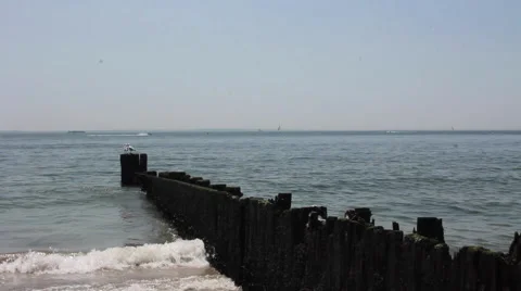 Beach Waves Crashing On Pier Stock Footage 64637517