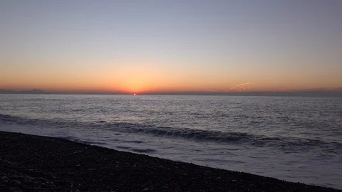 BEACH WITH WAVES IN THE DAWN WITH SKY SERENE IN WINTER Stock Footage 100969917