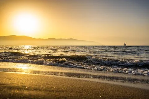 Beach waves during sunset in slow motion. Vlore, Albania Stock Photos