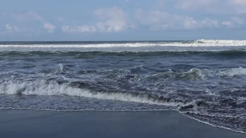 Beach waves with foam during the day on a blue sky background. Stock Footage 162295538