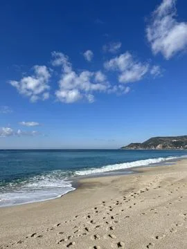 Beach waves footprints Stock Photos
