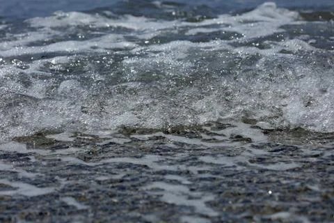 Beach waves macro background peristeres crete island covid-19 season modern h Stock Photos
