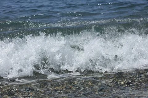 Beach waves macro background peristeres crete island covid-19 season modern h Stock Photos