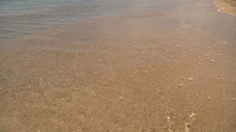 Beach waves moving low shot Stock Footage 30983594