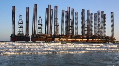 Beach waves with oil platform in ocean. Caspian sea offshore oil rig drilling pl Video stock 61786174