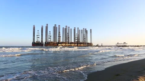 Beach waves with oil platform in ocean. Caspian sea offshore oil rig drilling pl Video stock 61786265