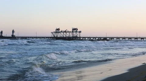 Beach waves with oil platform in ocean. Caspian sea offshore oil rig drilling pl Video stock 62019840